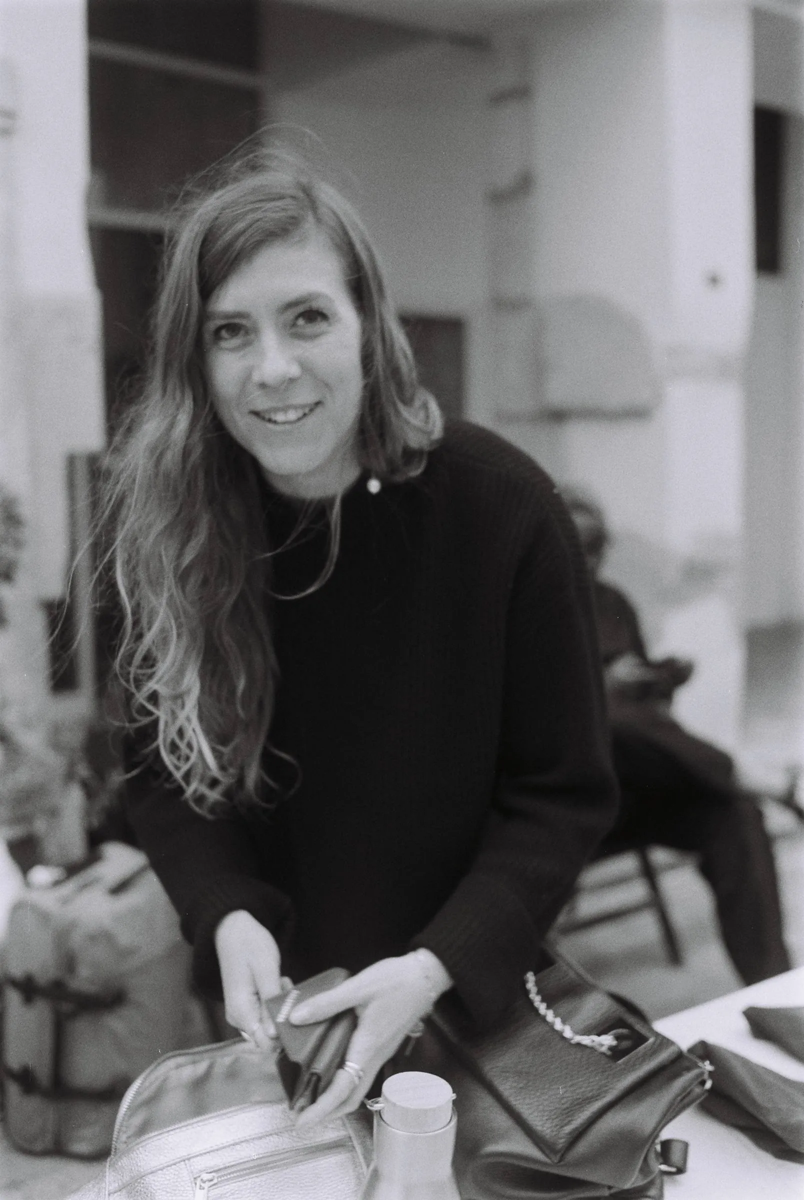 Smiling woman with long hair, black and white